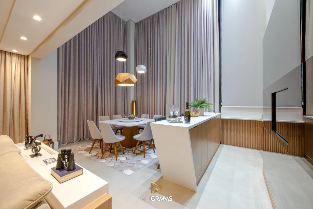 Spacious open-concept room with high ceiling and Accord pendants
