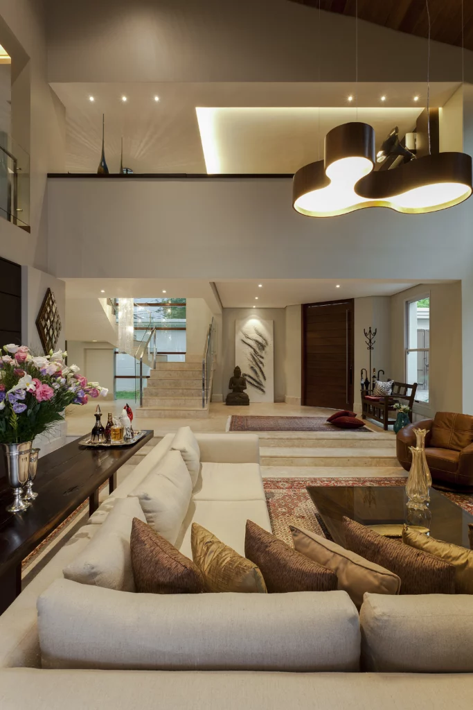 Modern open-concept room with double-height ceiling and Accord fixture
